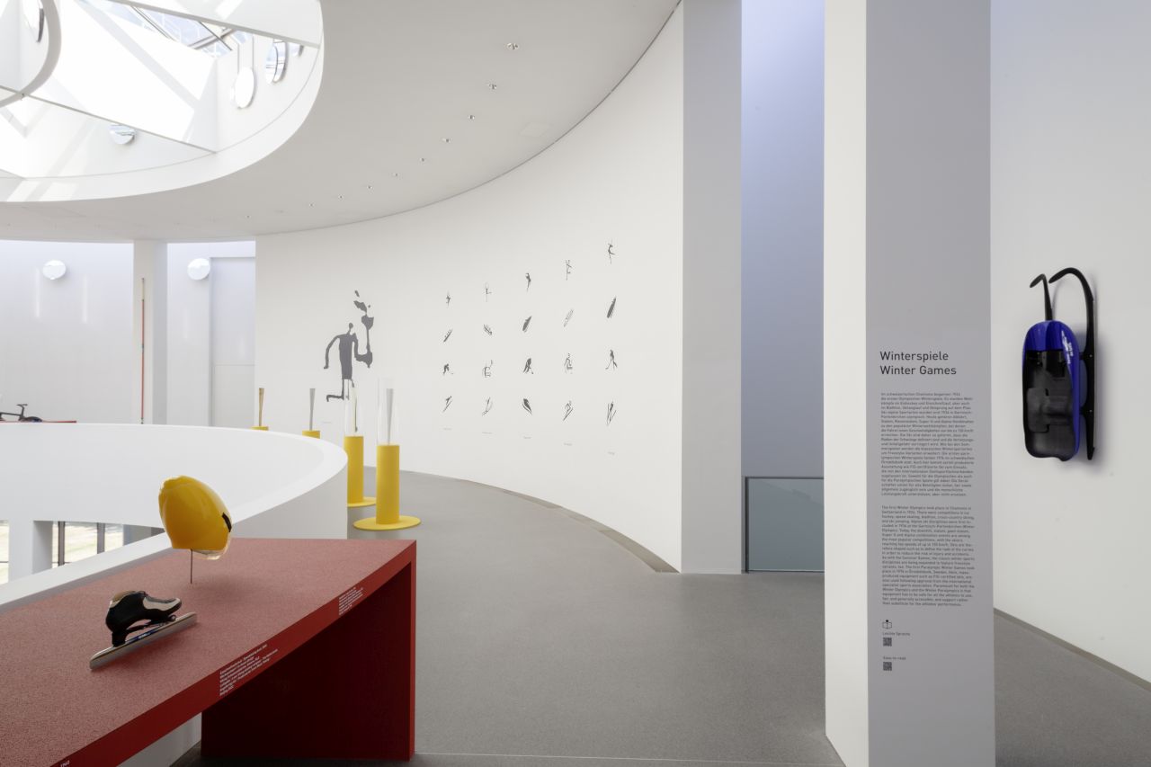 View of the second floor of the rotunda with various sports equipment for the sports disciplines of the Winter Games