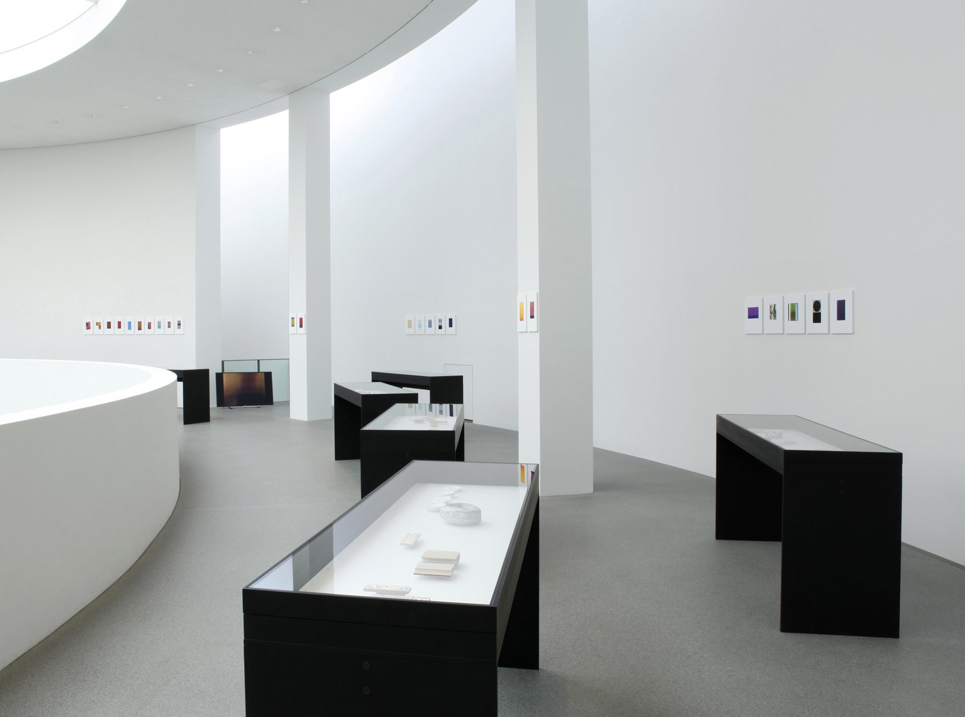 View of the 2nd floor of the rotunda with black table showcases