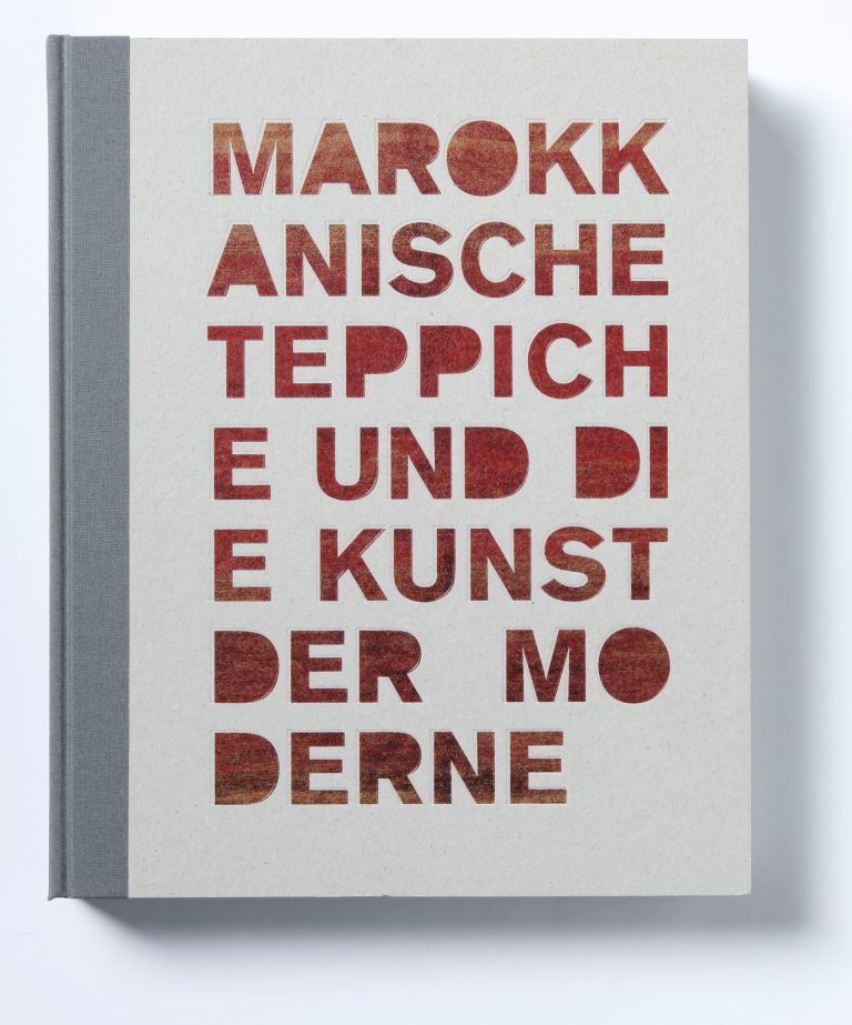 Book cover with title of the exhibition. Red letters and grey Line on the left.