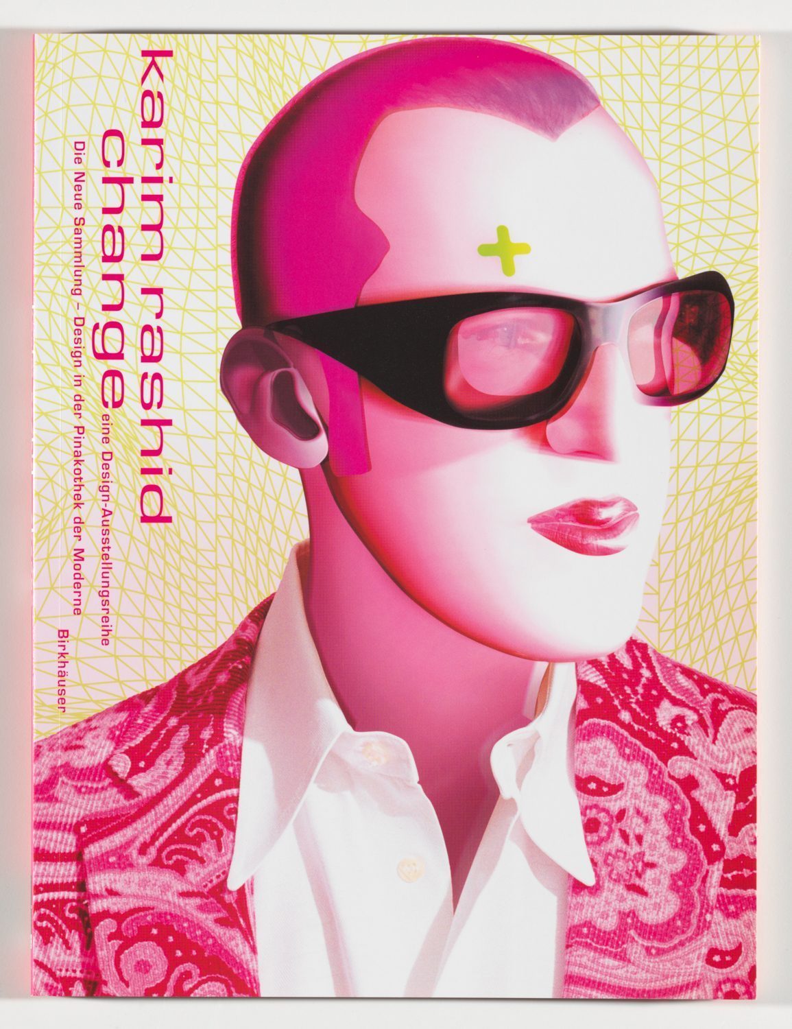 Three-quarter-view shoulder portrait of Karim Rashid, painted in a pop-art style, wearing sunglasses. A grey cross above his right brow. Inscription on the left from top to bottom: Karim Rashid change. The predominant colour is pink.