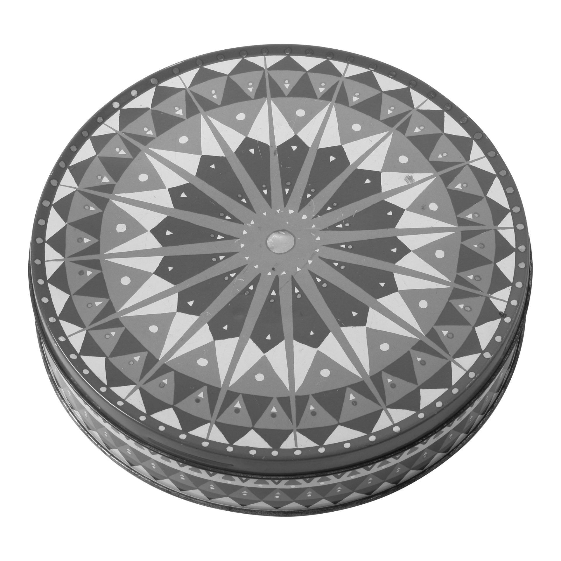 Schwarz-weiße Fotografie der runden Keksdose mit sternförmigen geometrischen Musters.