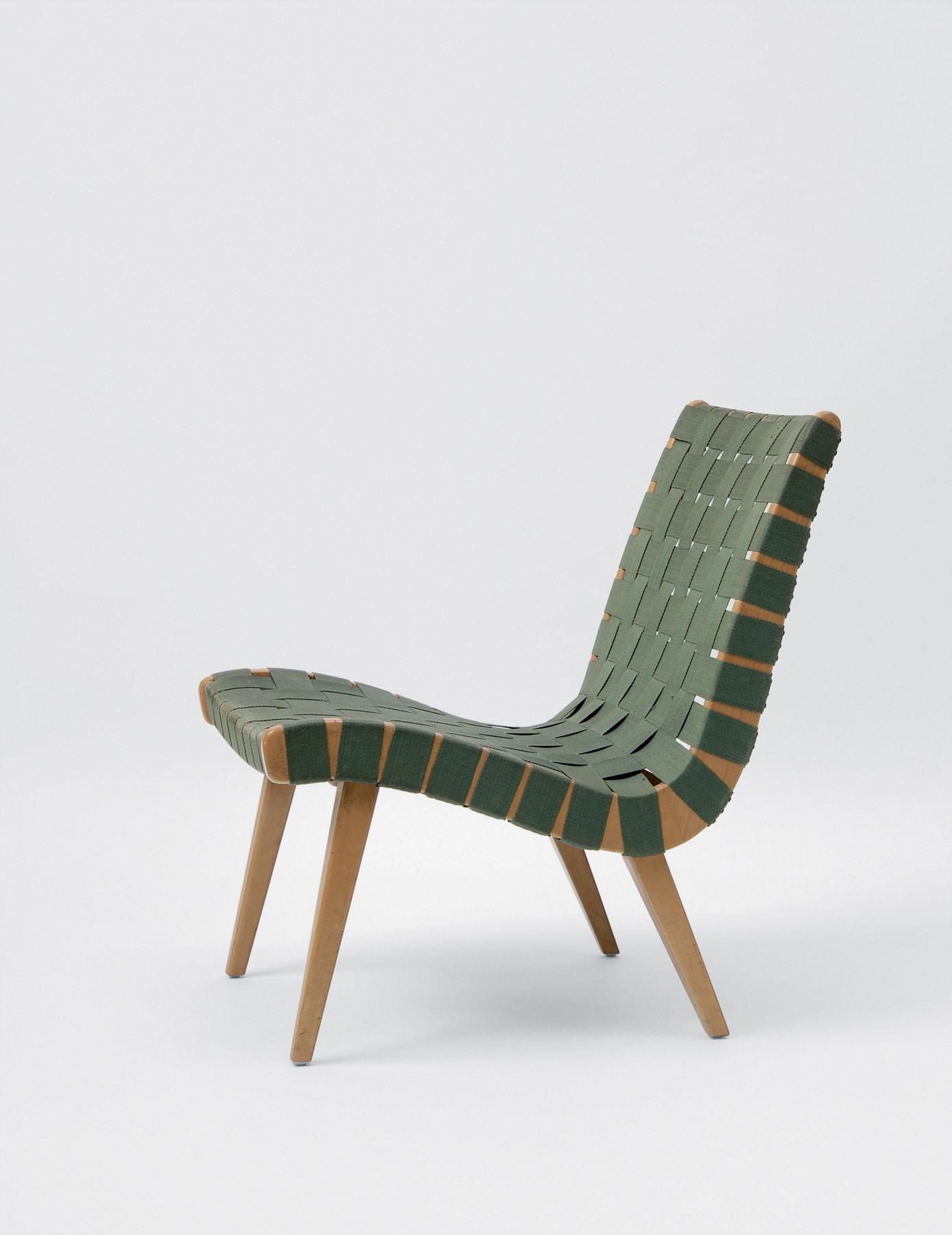 Lounge chair with wooden frame and woven, olive green seat and backrest.
