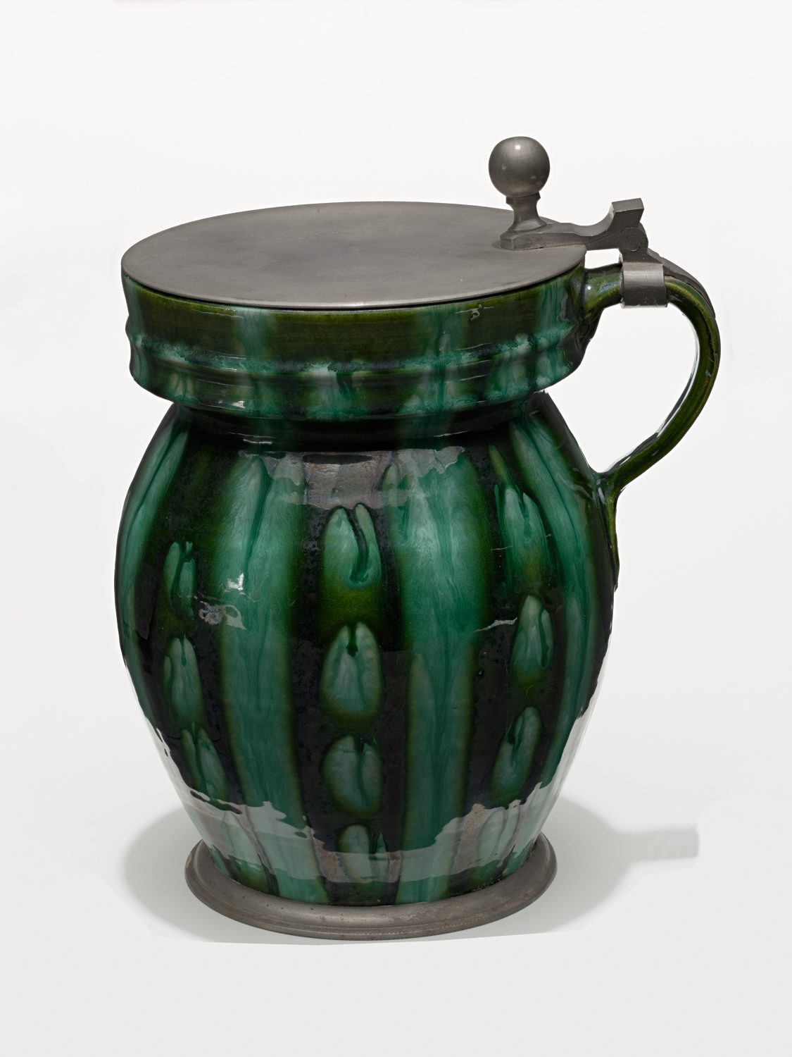 Material: Green barrel glaze. Pewter mounting.