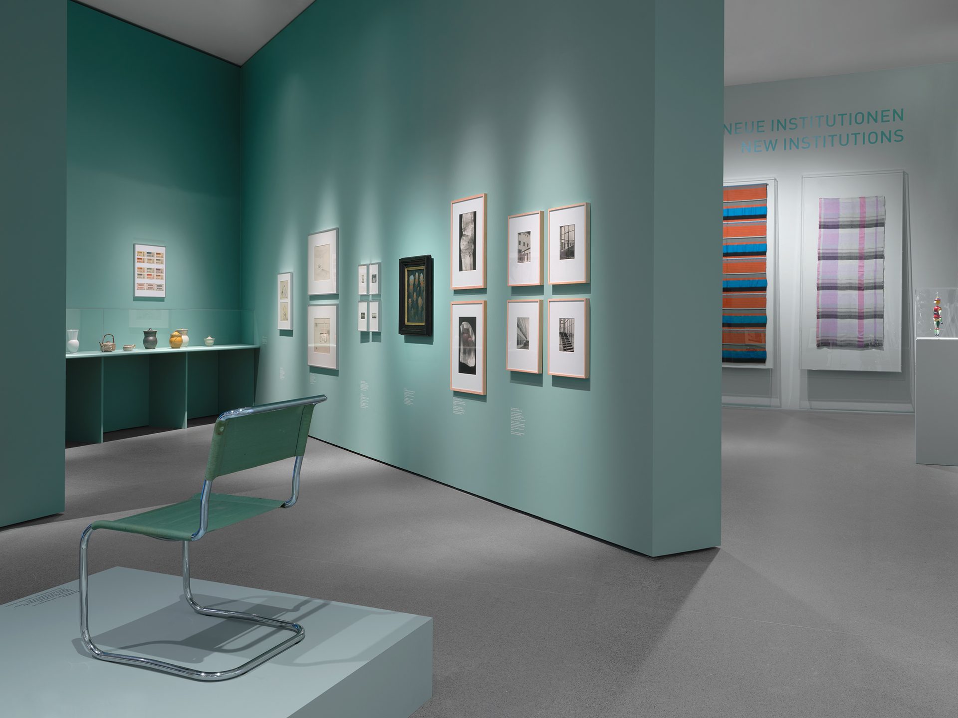 You can see the exhibition installation "4 Museums – 1 Modernism." You can see furniture, objects, and graphics.