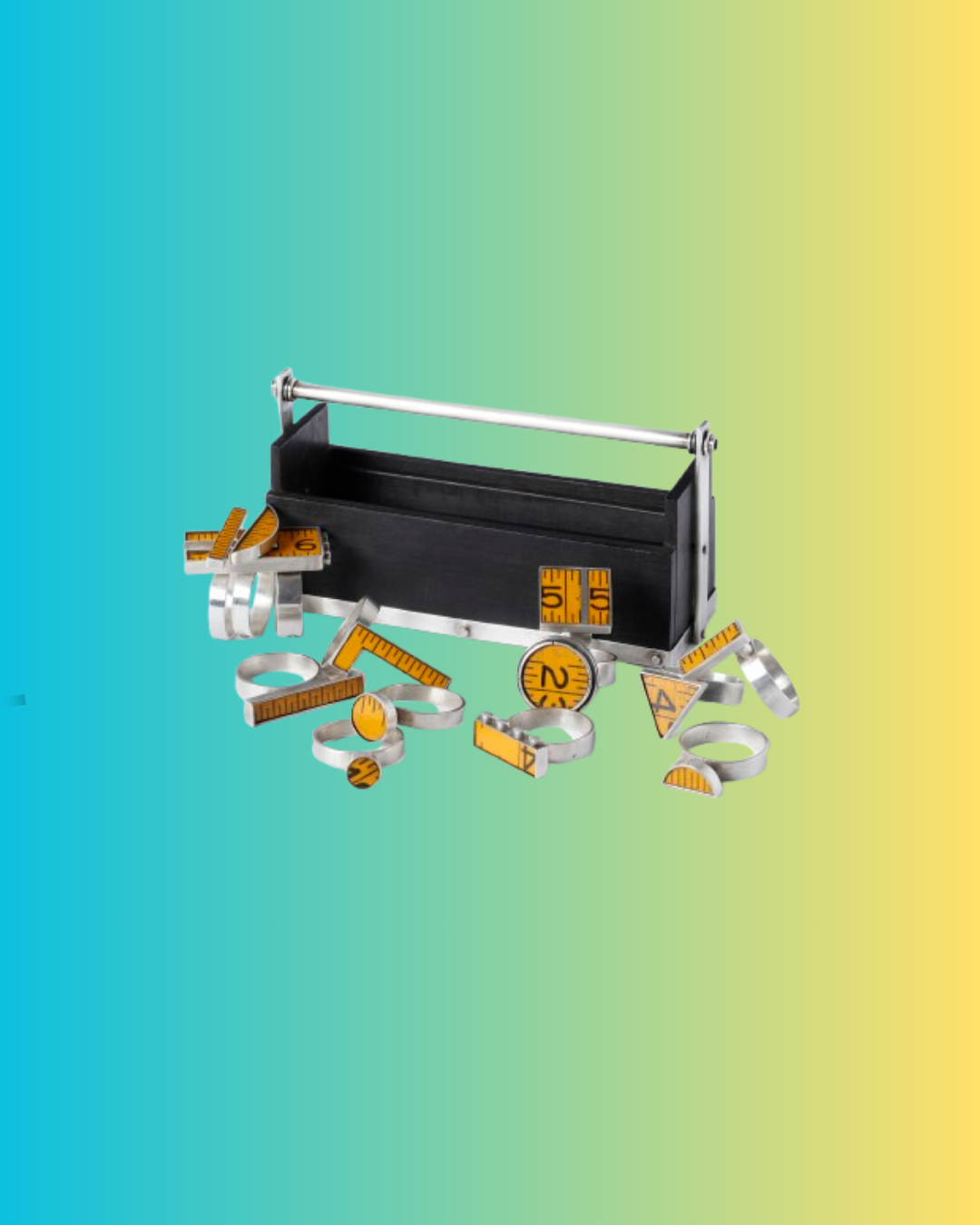 A black toolbox with yellow objects indicating units of measurement. It is a decorative object on a blue-yellow gradient background.