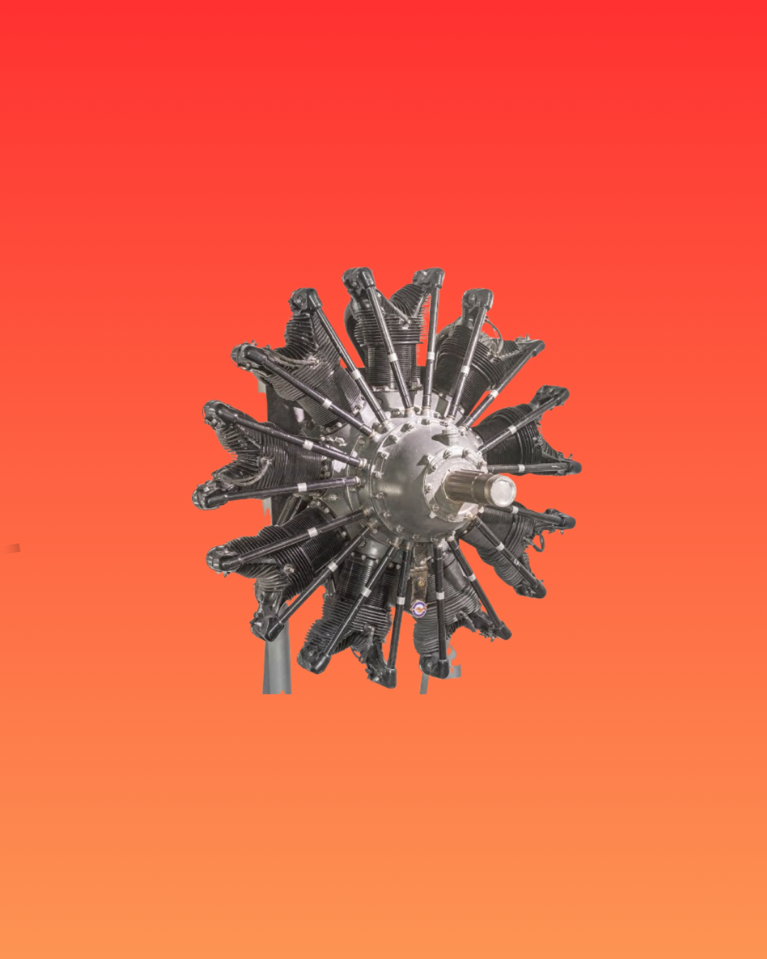 Star-shaped silver engine, side view, on a red background.