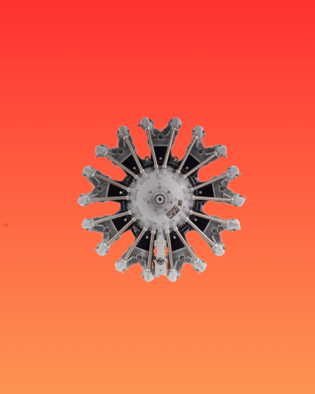 Star-shaped silver engine, front view, on a red background.